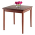 Start2Finish Pulman Extension Table in walnut wood, showcasing its sleek surface and extendable design for versatile dining space.