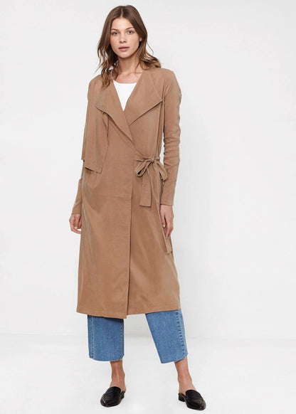 Women’s sand-colored wrap trench coat by Lemon Hera, stylish jacket with classic design and belt detail.