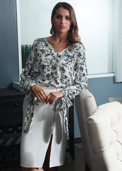 Ivory floral garden V-neck tie cuff blouse from Lemon Hera, featuring a stylish design with delicate floral patterns.