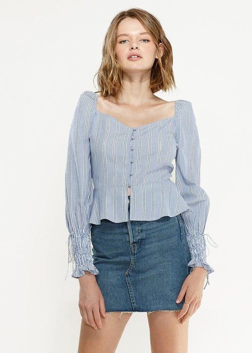 Blue Lemon Hera smocked cuff button-front peplum blouse, featuring long sleeves and a fitted waist, perfect for stylish tops and blouses.