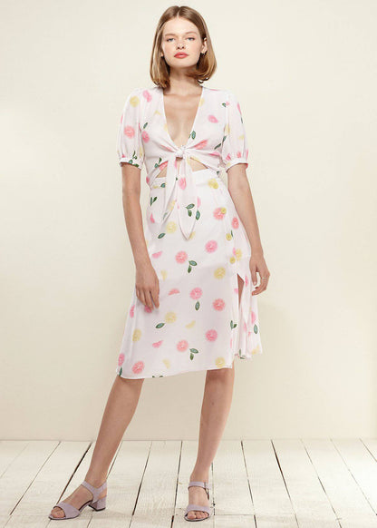 Lemon Hera Button Front Midi Skirt in vibrant Fruit Punch color, featuring a stylish button detail and flowing silhouette.