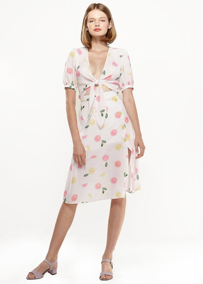 Lemon Hera button front midi skirt in vibrant Fruit Punch color, featuring a flowy design and button details.