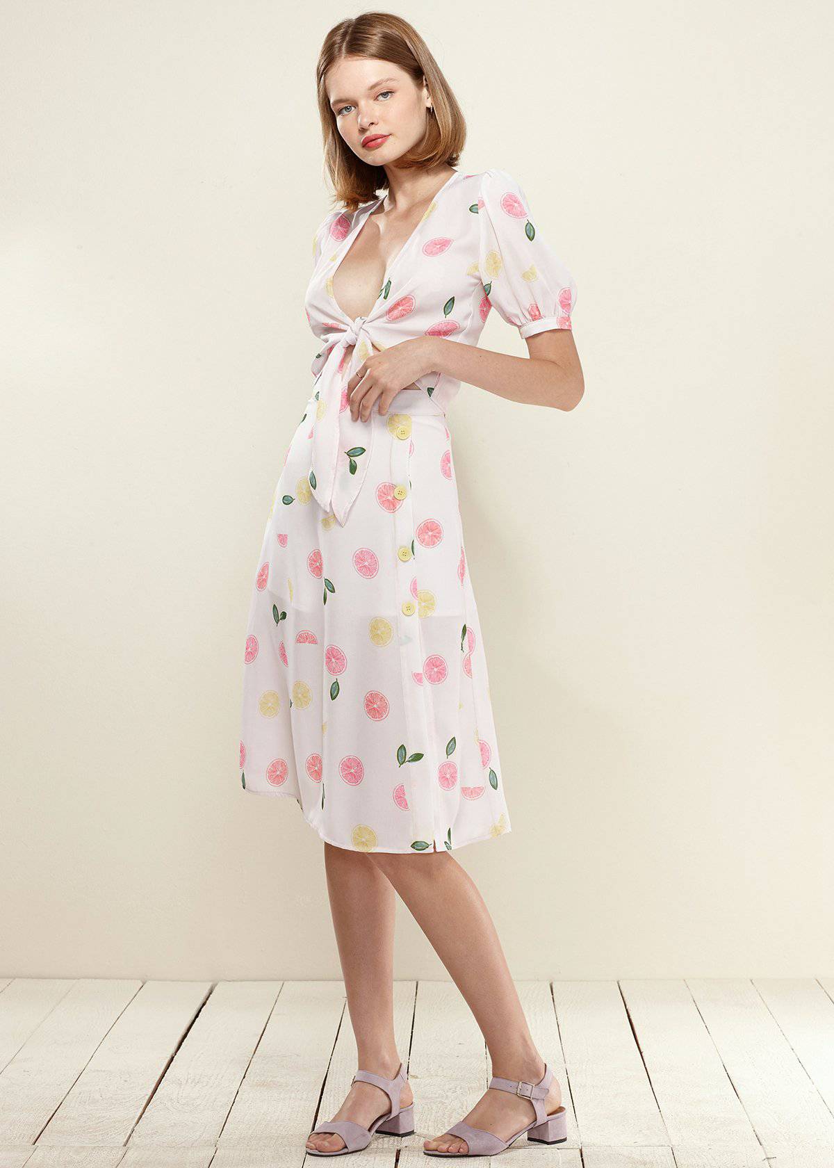 Lemon Hera Button Front Midi Skirt in vibrant Fruit Punch color, featuring a stylish button detail and flowy fabric.