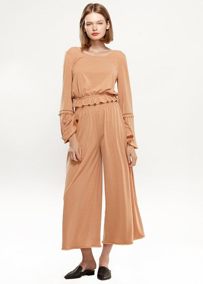 Lemon Hera smocked waist wide-leg palazzo pants in soft apricot fabric, flowing and comfortable for casual or chic outfits.