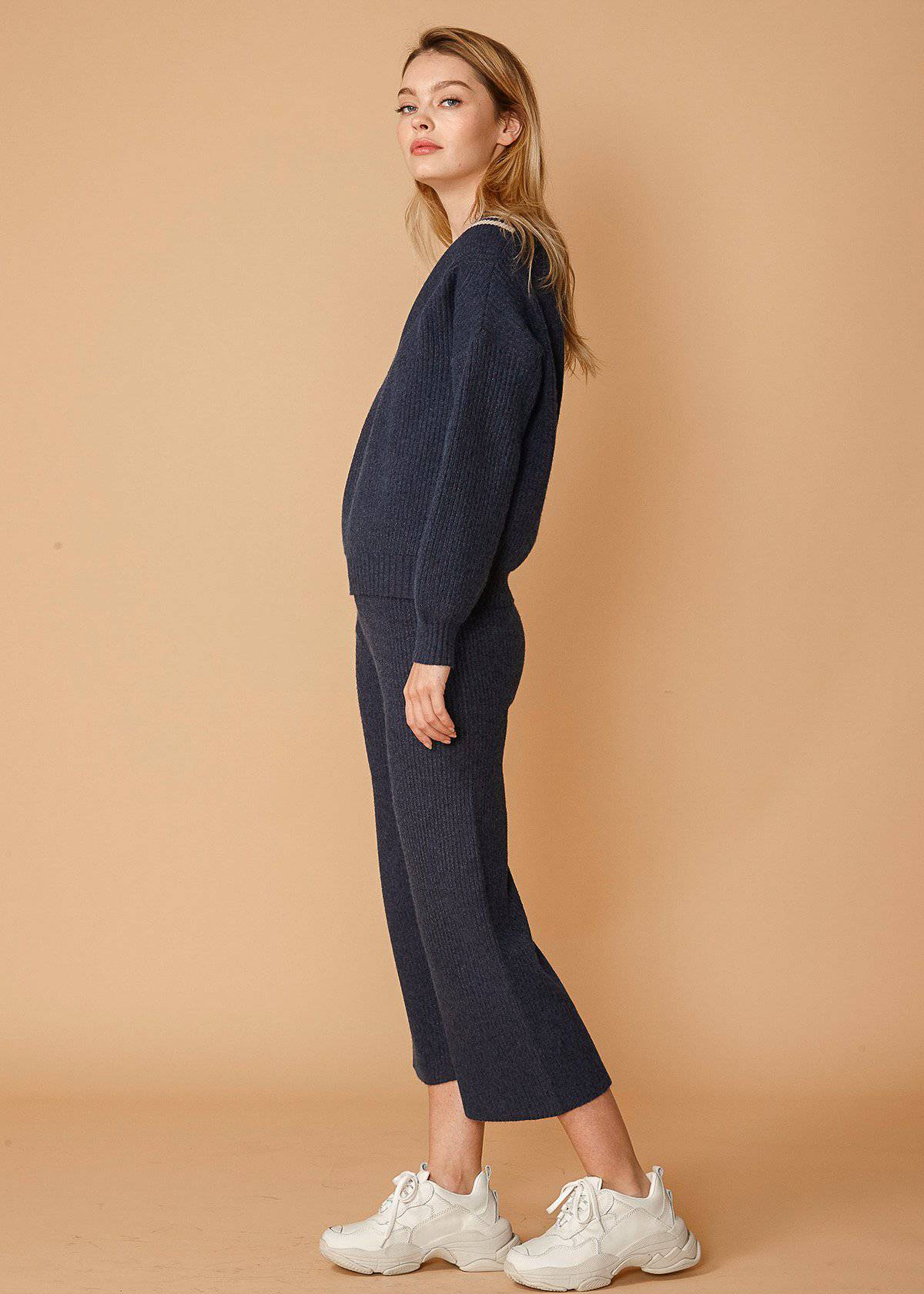 Women’s midnight navy varsity sweater by Lemon Hera, featuring classic varsity style with ribbed cuffs and collar.