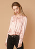 Lemon Hera fall pink tie-neck long sleeve bodysuit, fitted with a stylish tie detail at the neck and long sleeves.