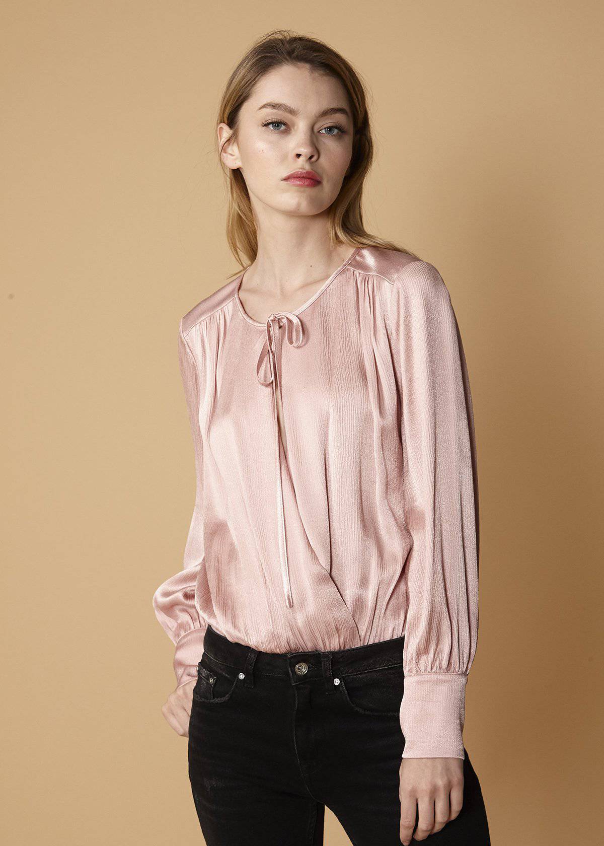 Lemon Hera tie-neck long sleeve bodysuit in fall pink, featuring a stylish tie-neck detail and fitted long sleeves.
