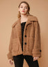Women’s brown shearling coat by Lemon Hera, stylish and warm jackets and coats with plush shearling details.