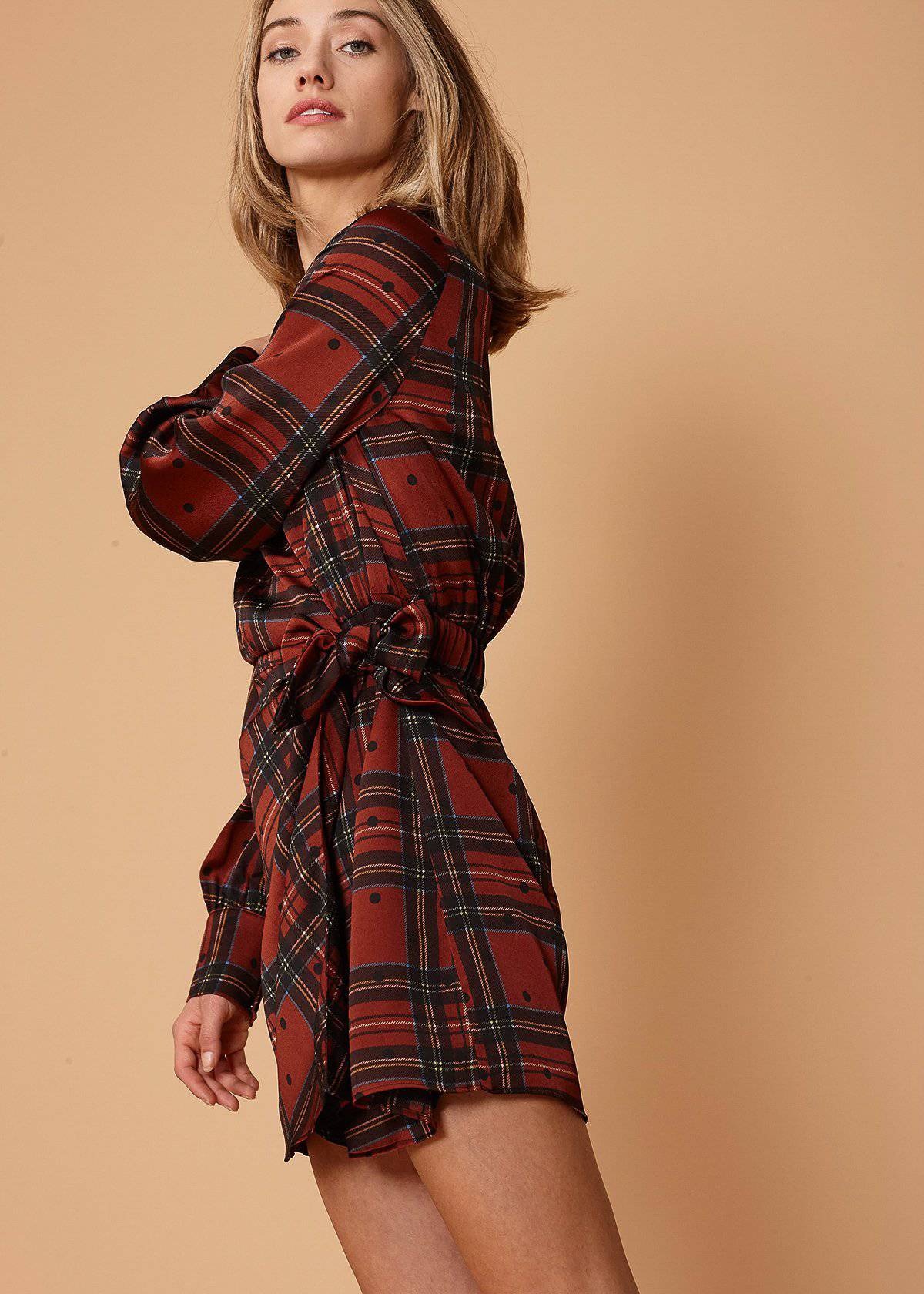 Lemon Hera plaid and polkadot mini wrap dress in brick color, featuring a stylish, fitted design with long sleeves.