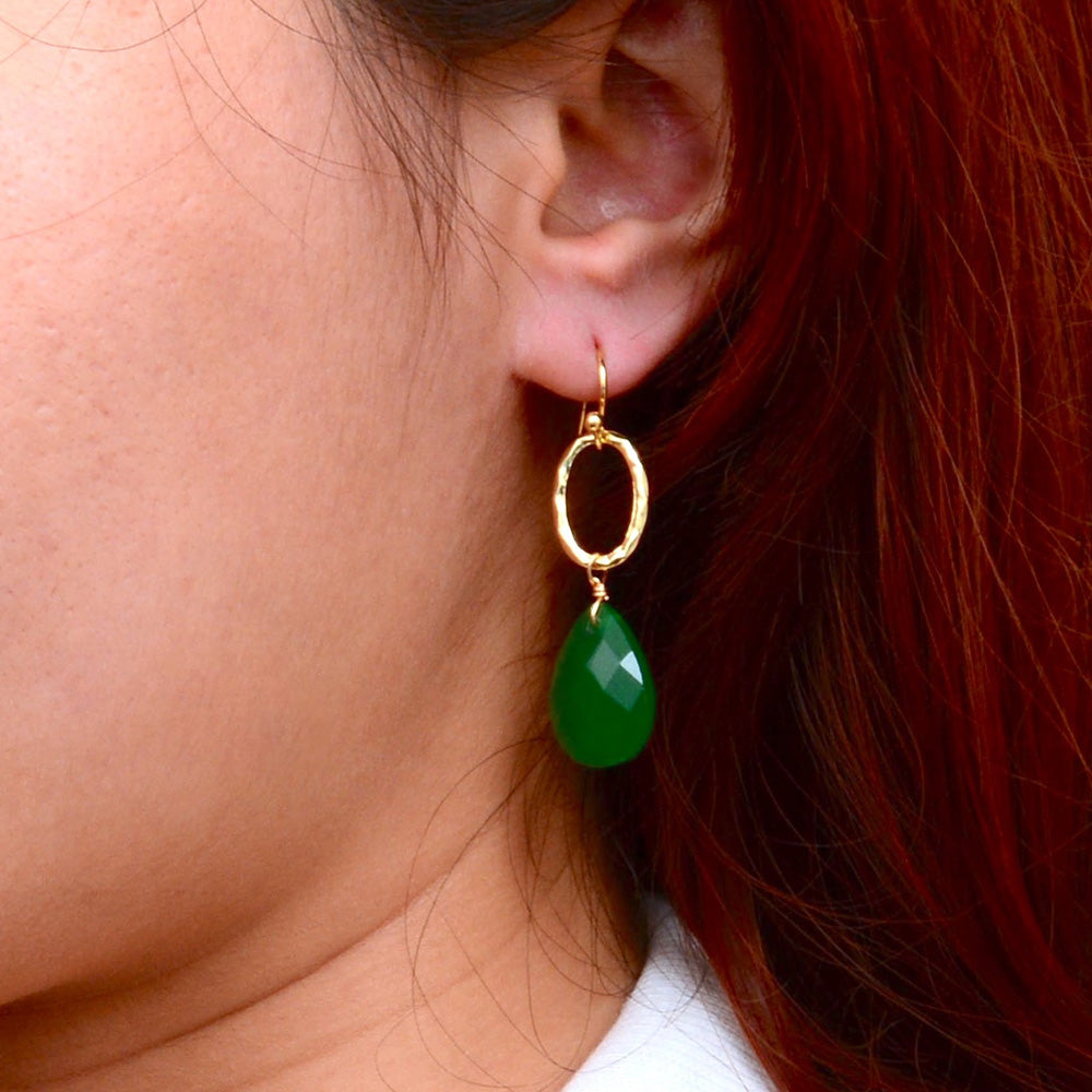 Vibrant green onyx drop earrings with gold accents, jewelry piece featuring elegant design and polished finish.