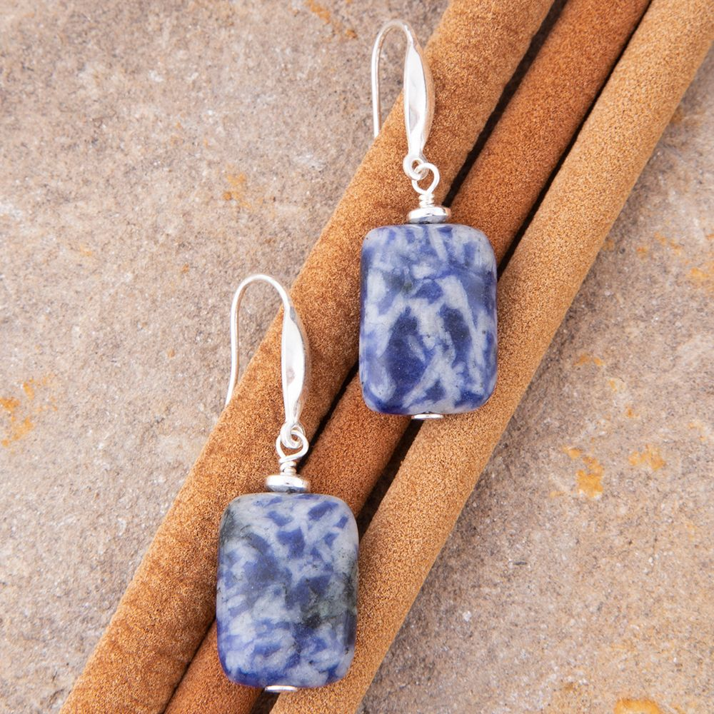 Denim blue quartz silver drop earrings featuring sleek jewelry design with silver hooks and vibrant blue gemstones.