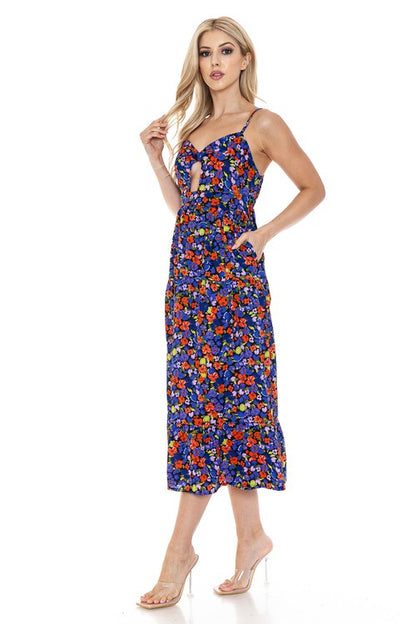 Women’s floral maxi dress by Jade Icarus featuring a flowing silhouette and vibrant flower pattern on lightweight fabric.