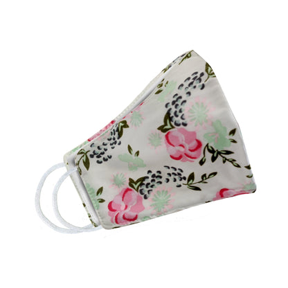 Light green floral face mask for women by Cyan Poppy featuring pink and green flower patterns, shown from a side angle.