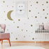 Gold crescent moon wall stickers set featuring 115 stars for baby shower or nursery decor, made of decorative vinyl decals.