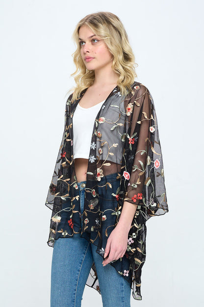 Floral embroidered mesh oversized kimono for women by Indigo Arrowwood, featuring colorful floral patterns and lightweight fabric.