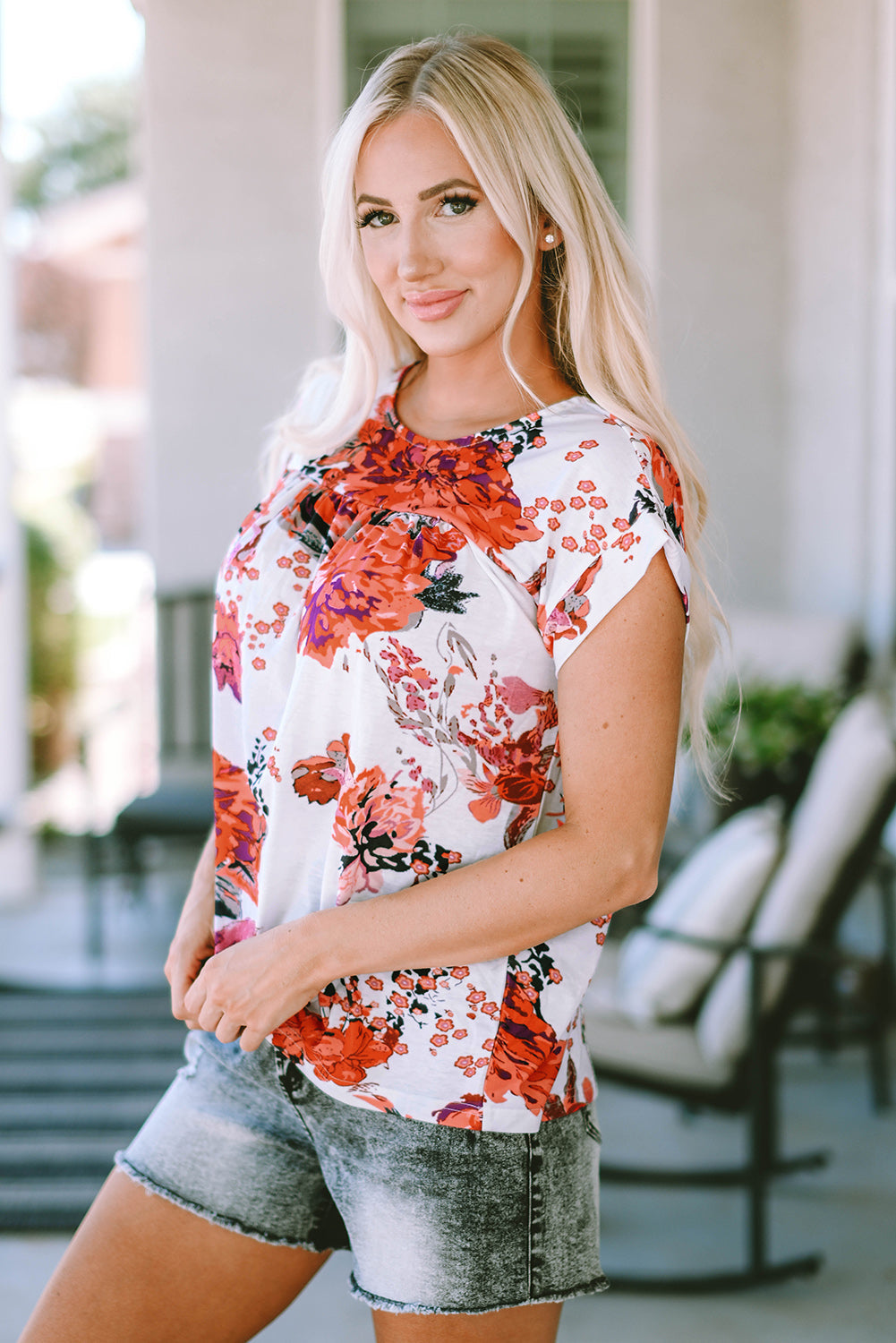 Fiery red floral short sleeve blouse with round neckline from Carmine Juneberry, perfect for casual or dressy occasions.