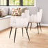 Set of two ivory Noosa Dining Chairs by Start2Finish with sleek wooden legs and upholstered seats in a modern dining room setting.