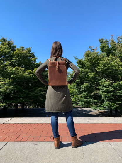 Start2Finish Sachi leather backpack for women, small stylish leather accessory with adjustable straps and top handle.