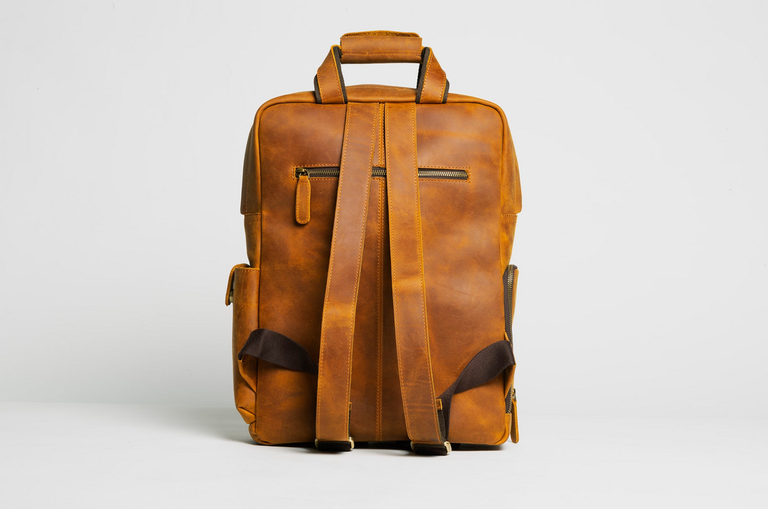 Large capacity leather camera backpack from Start2Finish, designed for accessories, with multiple compartments and adjustable straps.