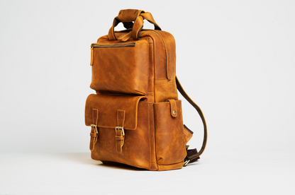 Large leather camera backpack from Start2Finish, The MANN Bag with multiple compartments and adjustable straps for accessories.