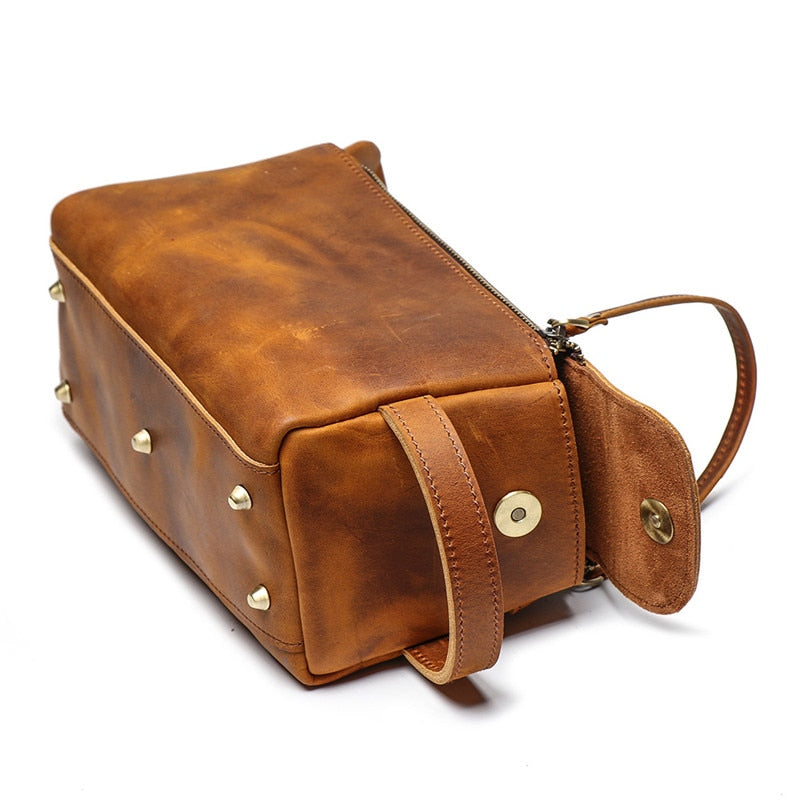 Handmade leather Dopp kit by Start2Finish, featuring a compact, durable leather toiletry bag with a zipper closure and leather handle.