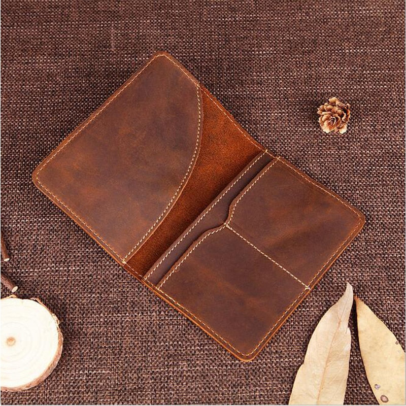 Priam handmade leather passport cover from Start2Finish, showcasing a sleek brown leather design with stitching details.
