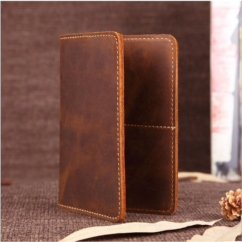 Priam handmade leather passport cover by Start2Finish showing brown textured leather with stitched edges and a sleek design.