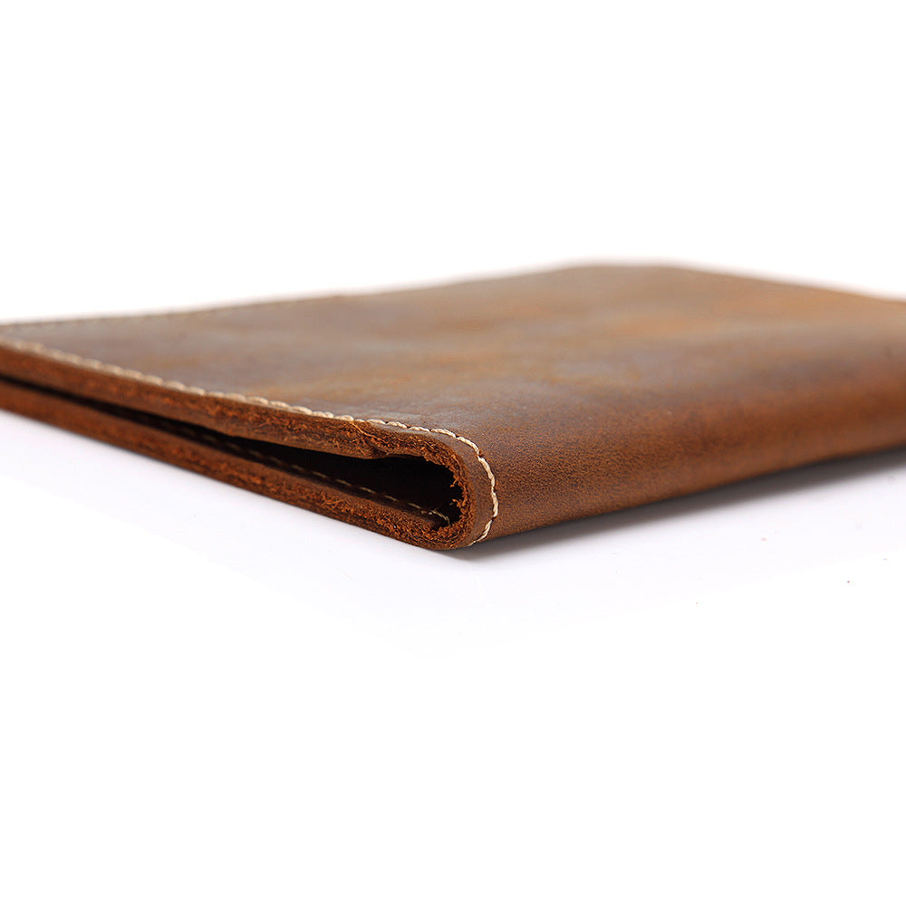 Priam handmade leather passport cover by Start2Finish, showing a sleek brown leather accessory with embossed branding and card slots.