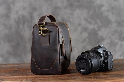 Small leather camera bag and lens case from Start2Finish, featuring compact design and durable leather for accessories storage.