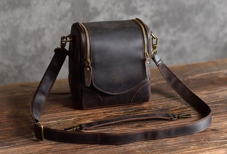 Small leather camera bag by Start2Finish, featuring compact design and leather lens case for accessories and photography gear.