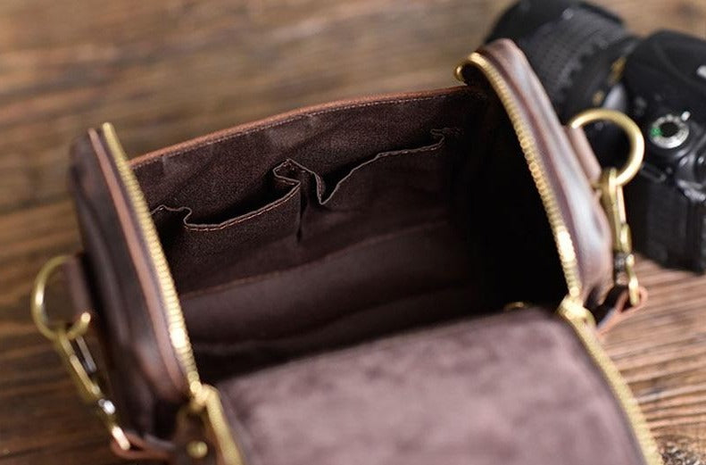 Small leather camera bag by Start2Finish, designed as a compact leather lens case for photography accessories.