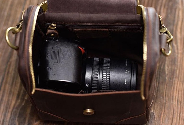 Small leather camera bag and lens case by Start2Finish, stylish accessories for carrying camera gear securely.