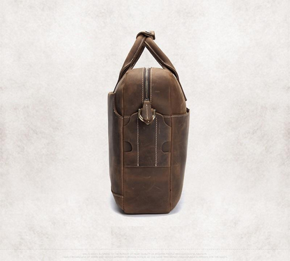 Vintage leather Welch Briefcase messenger bag by Start2Finish, featuring a classic design with sturdy leather straps and spacious interior.