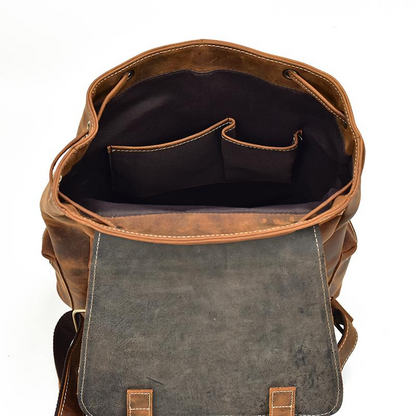 Vintage leather Hagen backpack by Start2Finish, featuring durable leather straps and classic accessory design.