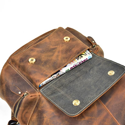 Vintage leather Hagen backpack by Start2Finish, showcasing adjustable straps, spacious main compartment, and stylish accessories design.
