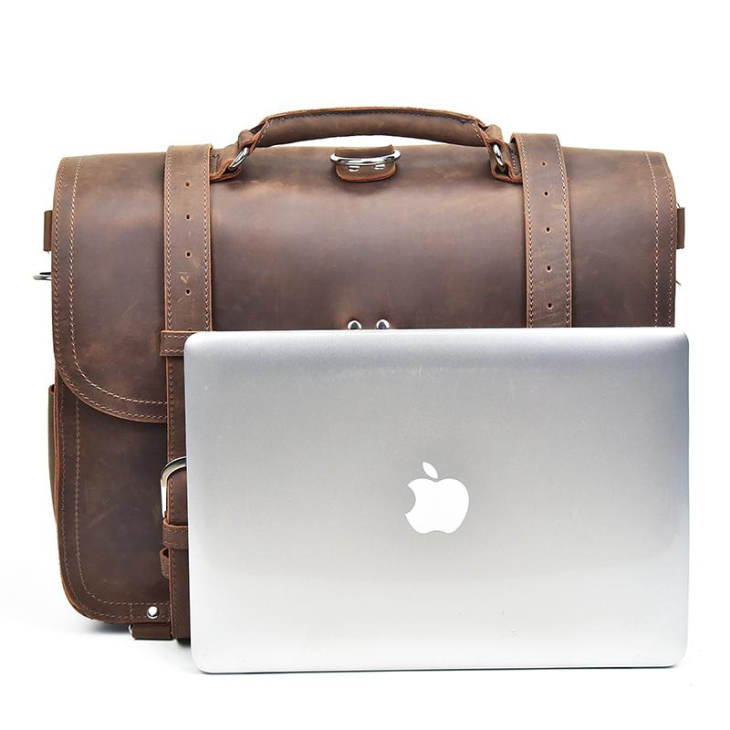 Vintage leather Gustav Messenger Bag by Start2Finish with large capacity, featuring sturdy straps and classic accessory design.