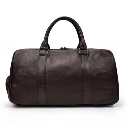Start2Finish Endre Weekender vintage leather duffle bag with sturdy handles and spacious interior, perfect for travel accessories.