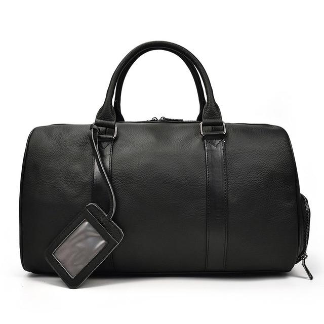 Start2Finish Endre Weekender vintage leather duffle bag with handles and shoulder strap, showing its classic design and spacious interior.
