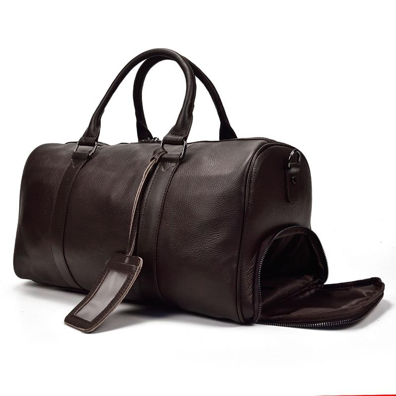 Vintage leather duffle bag from Start2Finish, the Endre Weekender, with sturdy handles and a spacious main compartment.