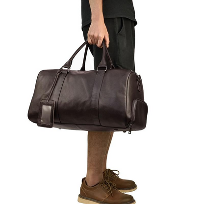 Start2Finish Endre Weekender vintage leather duffle bag with handles and zipper closure, showcasing its durable leather exterior.