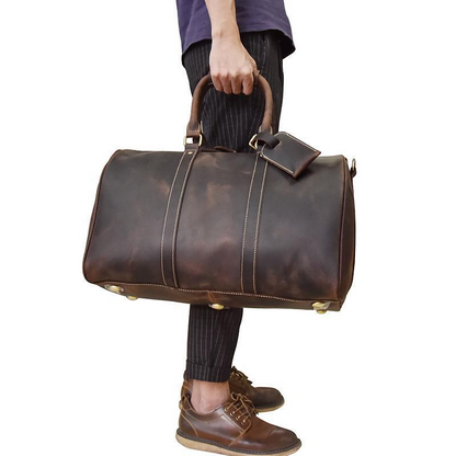 Handcrafted leather duffle bag from the Bjarke Weekender collection by Start2Finish, featuring sturdy handles and elegant design.