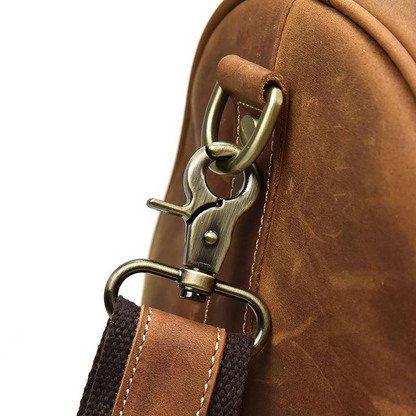 Start2Finish Bjarke Weekender handcrafted leather duffle bag with sturdy handles and spacious interior for travel accessories.