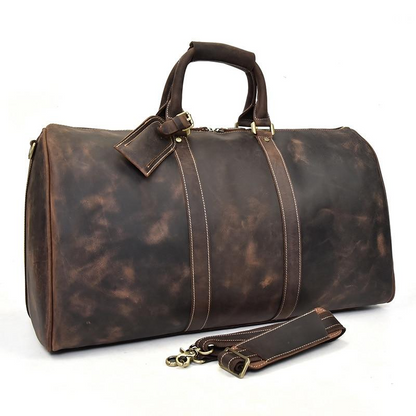 Start2Finish Bjarke Weekender handcrafted leather duffle bag with sturdy handles and spacious interior for travel accessories.