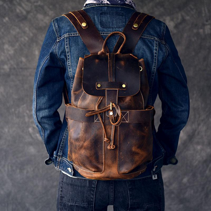 Olaf Rucksack vintage leather travel backpack by Start2Finish, showing sturdy straps and spacious interior for accessories and travel essentials.