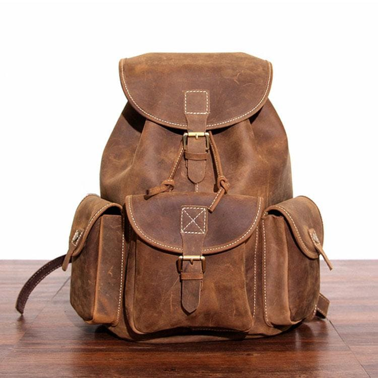 Start2Finish Asmund Backpack made of genuine leather, featuring a stylish rucksack design with adjustable straps and multiple compartments.