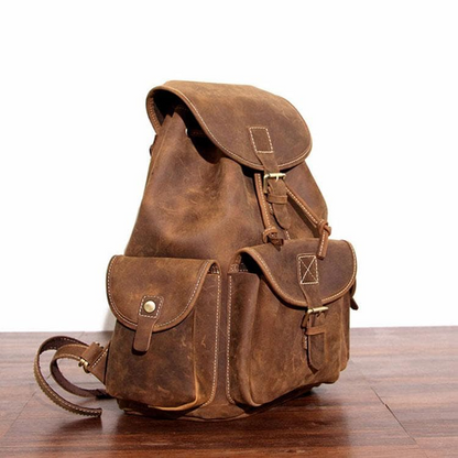 Start2Finish Asmund Backpack with genuine leather rucksack design, featuring adjustable straps and a spacious main compartment.