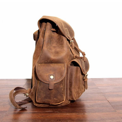 Start2Finish Asmund Backpack made of genuine leather, showing the classic rucksack design with adjustable straps and front pocket.