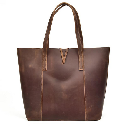 Handcrafted leather tote bag from Start2Finish, The Taavi Tote, showing its spacious interior and stylish accessory design.