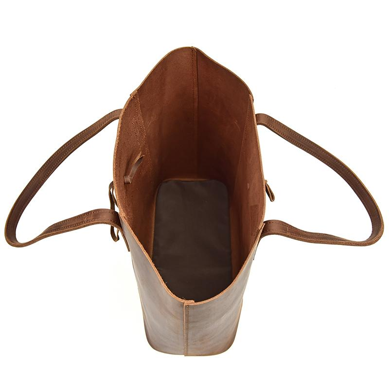 Start2Finish Taavi Tote bag made of handcrafted leather, showcasing its spacious design and durable straps.