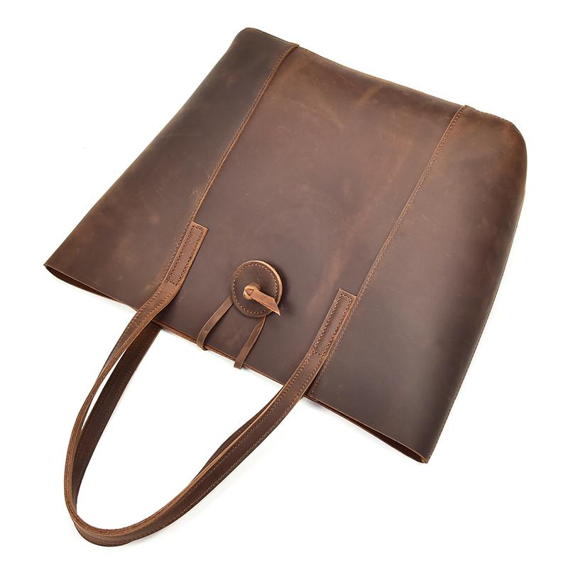 Start2Finish Taavi Tote bag made of handcrafted leather, showcasing its spacious interior and stylish accessory design.